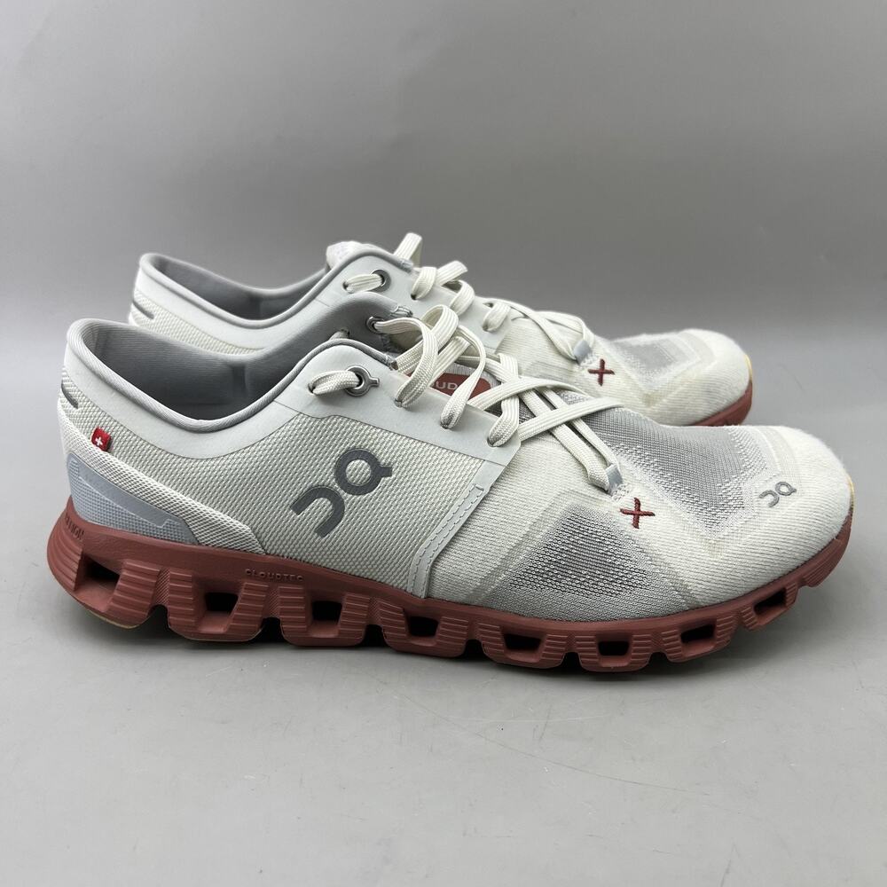 On Running White and Red Athletic Shoes